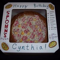 Pizza In Box This is a ham and pineapple pizza made with yellow cake. The sauce is made from red modelling chocolate with a layer of buttercream...