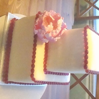 Ivory Wedding 8" & 4.5" red velvet cakes w/ SMBC. Covered with ivory mmf. Decorated with fuschia sugar beads and gumpaste peony. Pretty...