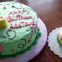 Baby Bugs Half chocolate, half white cake. Number 1 is also carved cake. Buttercream icing. Smash cake was made using half of the Wilton ball pan.