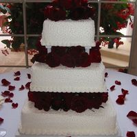 Devora Wedding Cake This is a white cake, with buttercream icing. The design is lace with deep dark red rose.