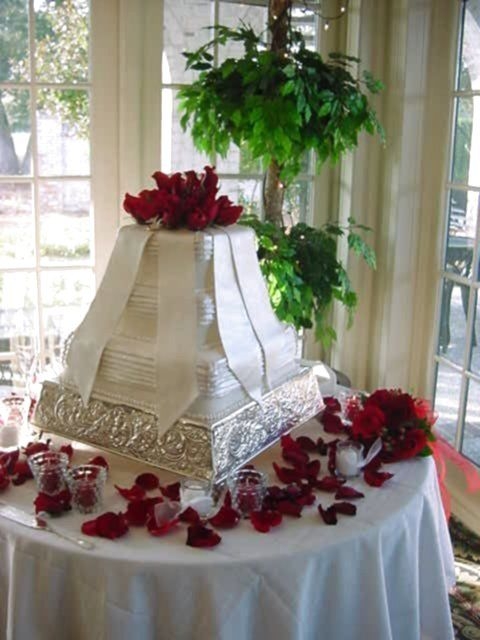Bridgette I loved making this cake. A copy of her gown and since I'm also a floral designer, putting those red roses on it made it so inviting...