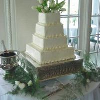 Laura's Song Simple. Elegant. Lovely with a touch of flowers. I have made this cake many times for others who want the simple and basic with a touch of...