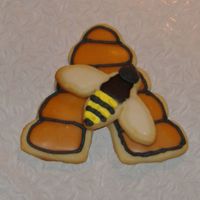 Bee And Beehive This is a cookie I did for a display cookie for where I work. It is two separate cookies that are glued together with royal icing. They are...