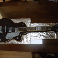 Guitar I made this cake for my son's 12 th. birthday. Everything is edible. I used upside down chocolate bars on the neck and the strings are...