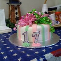 Birthday Bows White cake covered in MMF with cut stripes of MMF for accents, the actual bows on top were real. I tried to make a MMF bow and it was a...
