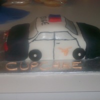 Patrol Car chocolate cake covered in MMF with royal icing writing and fondant accents. Made for my brother-in-law's birthday who is a policeman...