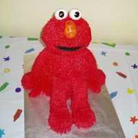 Elmo Bottom is a 10" round the the doll pan and the head is a round ball pan. Then I started carving. The arms and legs are fondant and the...