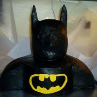 Batman I made this the same way as I made my Spiderman cake. I made the head out of a wondermold pan & carved it. it was frosted in...