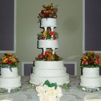 Wedding Cake This is the first wedding cake I ever made. Everything is done in BC icing. With Fresh Flowers. The top is 6inch, then 8inch, 12inch,...