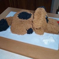 3D Dog 3d Black/Brown Dog with buttercream frosting with bone made out of frosting, too!