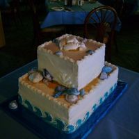 Seashell Wedding pineapple cake with coconut filling.the bride wanted blue and purple shells and waves on the cake but they had to look like white foam when...
