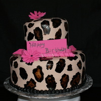 Leopard Cake red velvet cake used a recipe from on here, raspberry buttercream...yummy!I had made a loop bow topper but had problems and left it off. Wa...