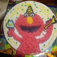 Buttercream Elmo Buttercream Elmo freehanded on cake, used grass tip for Elmos fur