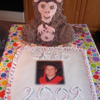 Monkey Grad Cupcake Cake Monkey is the 3d bear pan, bottom is cupcakes. Iced with whipped icing.