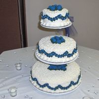 My Wedding Cake This was my first wedding cake and also the cake for my wedding. I used royal icing for the flowers and just a simple buttercream for the...