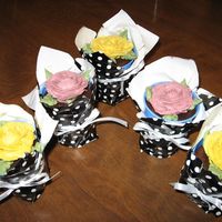 Cupcake Plant made these cup cakes with a rose.put in papercup and covered with wrapping paper to look like a plant.