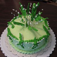 Lilies Of The Valley center flowers are royal icing on floral wire. cake is buttercream