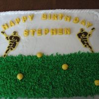 Lacrosse Cake cake is buttercream. players, balls, and writing is made out of white chocolate