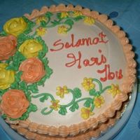 Mother's Day Cake Orange Butter cake topped with Buttercream Icing and Roses.