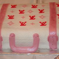 Louis Vuitton Coconut cake with lime curd filling. The icing is buttercream with fondant trim. It was for a bridal shower.