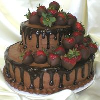 Double Chocolate 6' and 10" tiers; double chocolate cake, filled and iced with choc BC, ganache border with a cascade of 2 dozen chocolate covered...