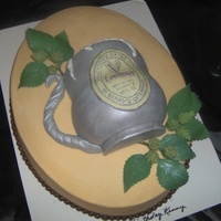 Tankard Of Ale Done like a wall plaque in buttercream with the large oval pan. Then carved the tankard from 6's and a 4" and covered in fondant...
