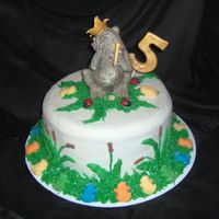 Amara's 5Th Birthday Mara loves frogs. I bought the top figure so she could keep it and put a fondant pad under him so I could set him on the cake, made him a...