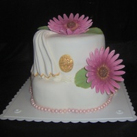 Foro My Miss Kathy chocolate cake with fondant and daisies- with gold edging on the leaves and drape.