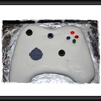 Xbox 360 This was Chocolate cake with cream cheese froasting and then fondant, the two joy stick's I did with loly pop sticks and recies...