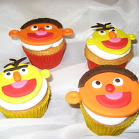 Bert & Ernie Cupcakes This was for a birthday party for twin boys. French Vanilla cupcakes with buttercream icing. The faces were made out of fondant.