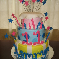 Kamryn's Cake This was my first attempt at a three tier cake. All cakes were covered in buttercream and fondant accents were used.