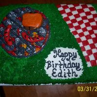 Bbq Birthday hotdogs and hamburgers are rolled buttercream icing. coals are marshmallow painted and dusted with conf. sugar