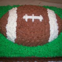 Football First football cake practice cake for friend's wedding- this is the grooms cake. Chocolate cake with chocolate cream chees frosing and...