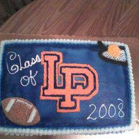 Lp Graduation Cake covered in buttercream. LP varsity letter has orange stars, football and tennis racket and ball made from stars also.