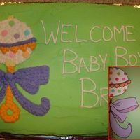 Rattle Baby Shower Cake This is a WASC cake I did for a baby shower. The invite they wanted it to look like is superimposed in the corner. Vanilla BC.
