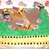 Construction Cake This was the cake for my twin sons' second birthday. Everyone loved it! It was yellow cake with caramel filling. Trucks are toys, dirt...