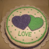 Course 1 First Cake The second session of Course 1 was on Valentine's Day, so our instructor let us do cakes with hearts. I only had purple and green...