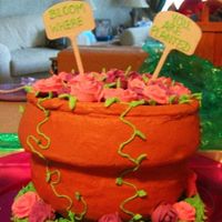 Flower Pot Cake The bottom layer was done in a Pyrex bowl, and top layer was 9" pan. Covered in buttercream, with Oreo "dirt". Roses are...