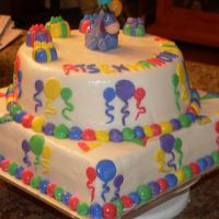 Cake_13_14_025.jpg this is from the wiltons book. it was for a babys first birthday party. bc icing with mmf, top is vanilla with lemon curd filling and the...