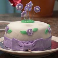 Cake7_009.jpg 2x2 choclate with mmf and too much powderd sugar. i think after the forth cake i did that day i just gave up and wanted it done now lol....