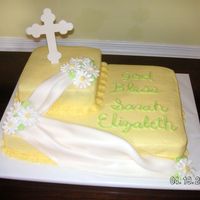 Sarah's Baptism Cake WASC with buttercream icing. Daisies are Royal Icing and the drape is fondant. The cross I cut out of a fondant and gumpaste mix from...