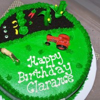 Boss's Birthday Cake butter cake with white chocolate mousse and oreo cookie filling. frosted with butter cream and fondant "vegetables" for the...