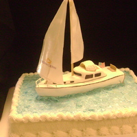 Groom's Sailboat Boat made from cake covered partially in fondant, sail from wafer paper.