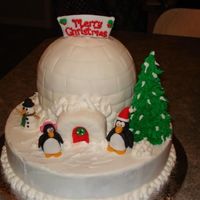 Igloo With Penguins Made this for my family christmas party.. First time molding figures from fondant/gumpaste.. They turned out sooo cute.. and then my nephew...