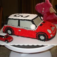 Mini Cooper Chocolate cake with buttercream... I started with the 3D cruiser from Wilton and did some carving and stacking to get the longer shape......