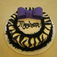 Meghann's Cake The customer had asked for a very small "token" cake, something with animal print and purple. There were a couple of cakes that I...