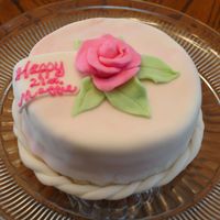 First Fondant Cake I made this cake for my cousin's 21st birthday. It is a White Russian cake (white cake filled with Kahlua buttercream.) The fondant...