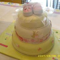 Baby Shower Cake This was my first cake w/MMF. Top cake classic white. Middle layer devil's food. Bottom layer white w/strawberry filling. Apliques are...