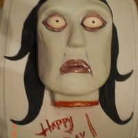 Dead Donna Cake THIS WAS MY FIRST CARVED 3D CAKE. MY INSPIRATION WAS A HALLOWEEN DECORATION I HAVE & THE WHOLE CAKE WAS COVERED & WITH FONDANT!