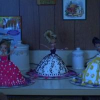 Bratz Cake (Gangs All Here) I am a beginner and I was given the cake pan by a friend. I pinned up the hair and removed the feet of the Bratz Dolls. I stuck the doll...